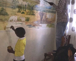 The work begins, with his young apprentice Theo